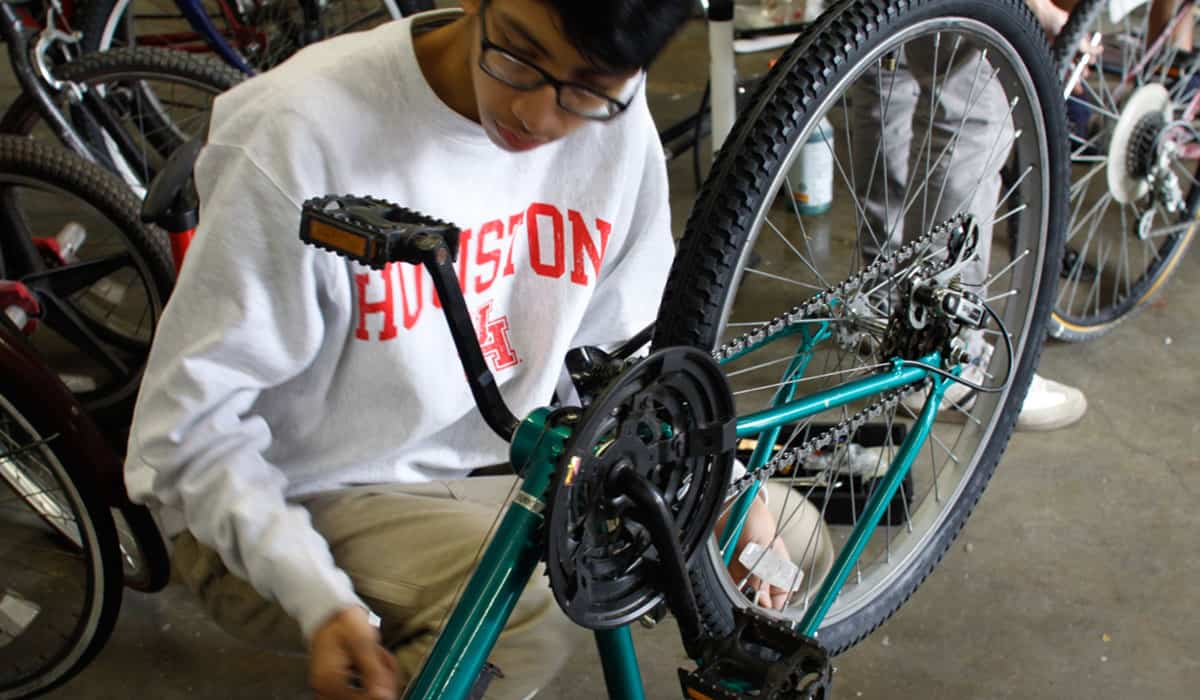 Getting a bike ready to ride is a welcome challenge for volunteers who represent the welcoming Houston community.