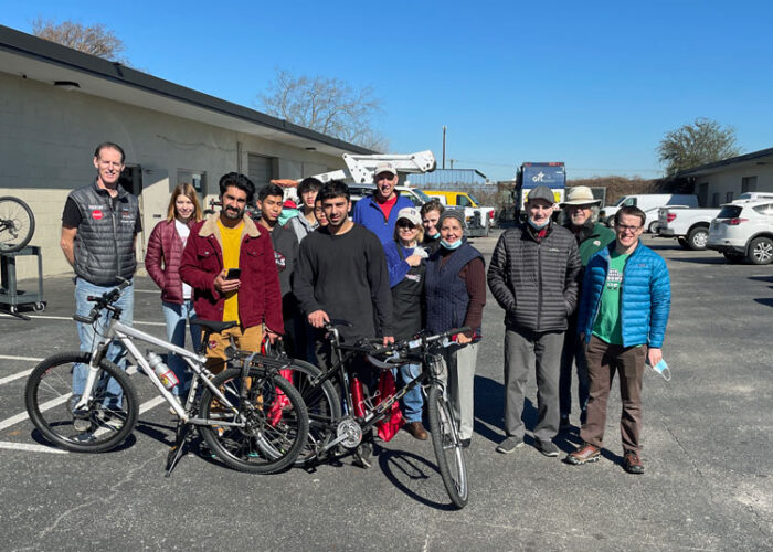 Freewheels volunteers with bike recipients at a bike shop day