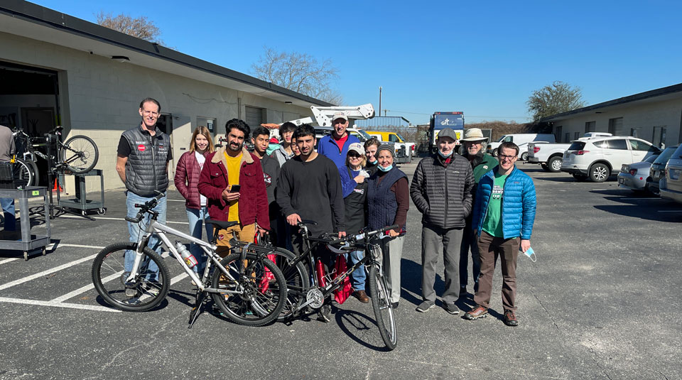 Freewheels volunteers with bike recipients at a bike shop day